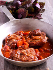 Osso buco (braised veal shank) with vegetables and gravy