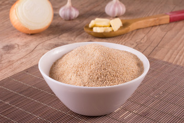 Toasted manioc flour into a bowl