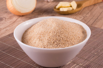 Toasted manioc flour into a bowl