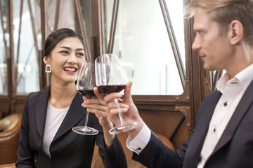 Woman testing Wine with attracitve smiling at restaurant. People Drinking Wine with Relax emotion.