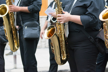 sax musician walking in the street