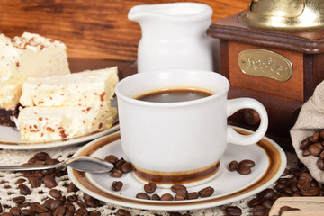 black coffee and cake coffee and an old coffee grinder