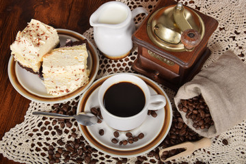 black coffee and cake coffee and an old coffee grinder