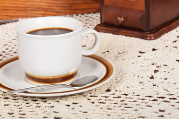 black coffee and cake coffee and an old coffee grinder
