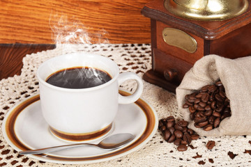 black coffee and cake coffee and an old coffee grinder