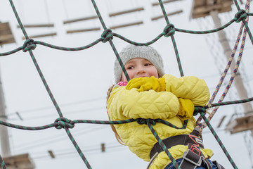 Little child on the obstacle course
