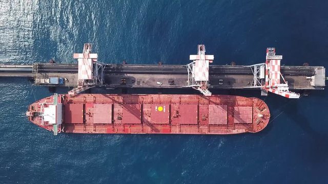 Bulk carrier docked in a Mediterranean port - Top down aerial view