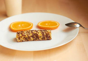 useful breakfast. Cereals and orange on a plate