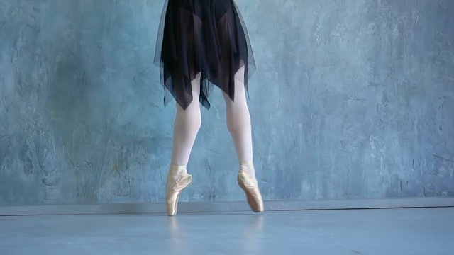 School of the ballet in Russia. The girl the ballerina in a beautiful suit. Beautiful expressive bellet dancer dancing at studio. Smoke Photo Shoot. Pretty little girl ballerina in pink dress