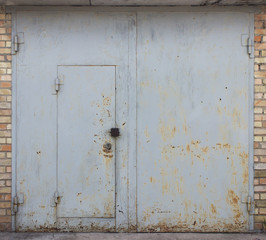 Metal gray gate with wicket door