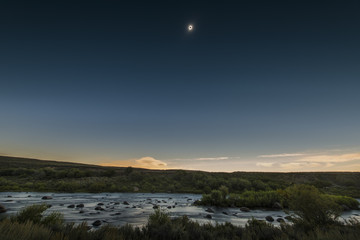 Full solar eclipse over the upper Green River in Wyoming.