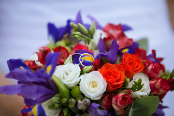 wedding decorative bouquet of rose with two golden rings