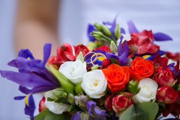 wedding decorative bouquet of rose with two golden rings