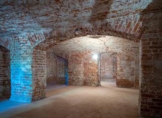 Old basement with arched columns and ceiling