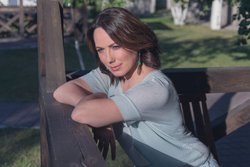 Portrait of a beautiful woman in the garden. People