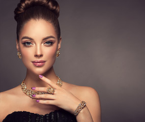 Beautiful girl with jewelry . A set of jewelry for woman ,necklace ,earrings and bracelet. Beauty and accessories.
