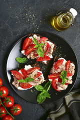 Rye sandwich with tomato,feta and tuna fillet.Top view with space for text.