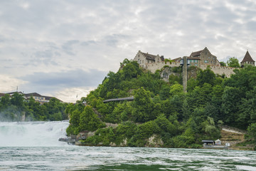 Fototapeta na wymiar The biggest waterfall - Rhine Falls with Laufen Castle at Europe