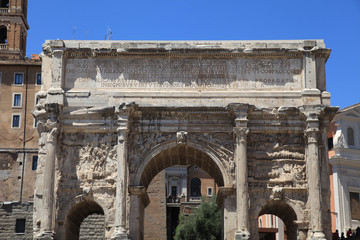 Fototapeta na wymiar Triumphal Marble Arch of Septimius Severus on the Capitoline Hill, Roman Forum, Rome, Italy