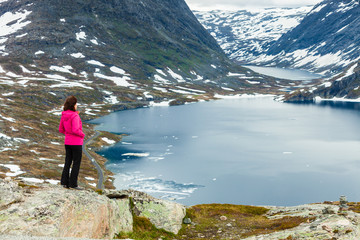 Fototapeta premium Tourist woman standing by Djupvatnet lake, Norway