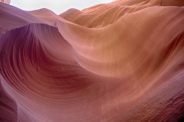 Lower Antelope Canyon was formed by erosion of Navajo Sandstone, primarily due to flash flooding and secondarily due to other sub-aerial processes.