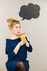 Happy woman holding fresh orange juice