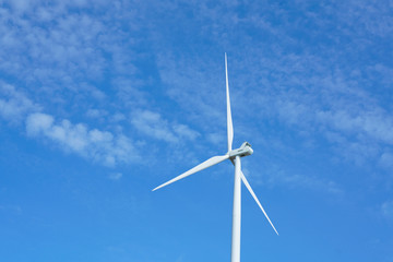 Wind turbines generating electricity with blue sky