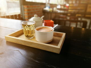 Cup of hot milk art coffee and tea in Thailand