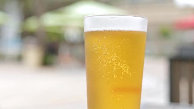 Glass of beer in outdoor bar
