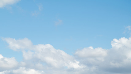 Naklejka na ściany i meble white clouds on a blue sky day