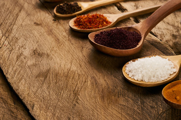 Wooden spoons with mixture of different East spices