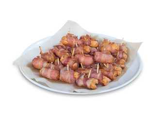 Deep fried sausages rolled in bacon isolated on white background