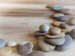 Fototapeta na wymiar Sea pebbles on a wooden surface