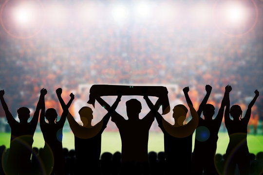 silhouettes of Soccer fans in a match and Spectators at football stadium