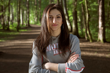 Smiling sporty girl relaxing on the park