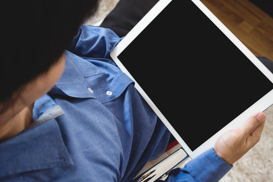 A Man Using Digital Tablet Computer, Sitting On Chair, Clipping Path Empty Black Screen