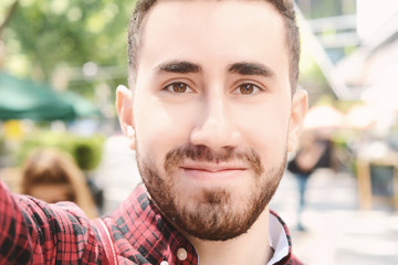 Fototapeta premium Man taking a selfie.