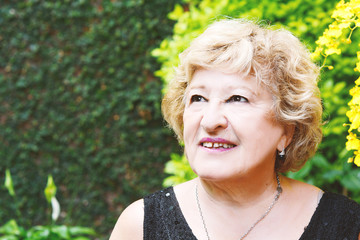 Elderly woman outdoors.