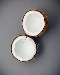 Whole of coconut shell on gray background flat lay and copy space. top view