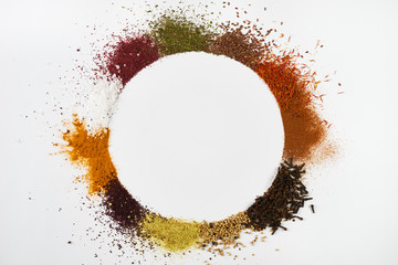 Circle frame composition of spices and herbs isolated on white - obrazy, fototapety, plakaty