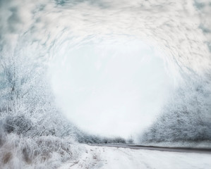 Frosty winter day landscape with Snow covered trees, road and beautiful sky after a blizzard