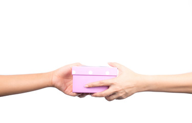 Closeup hands giving and receiving pink gift box isolated on white background