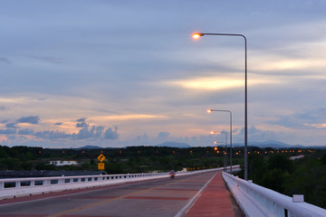 Traveling in the evening and the electric poles lining the shining path.