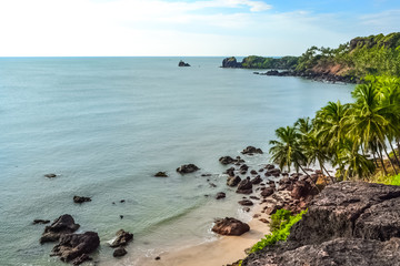 Fototapeta na wymiar Untouched Beautiful Beach off the Cliff in South Goa, India