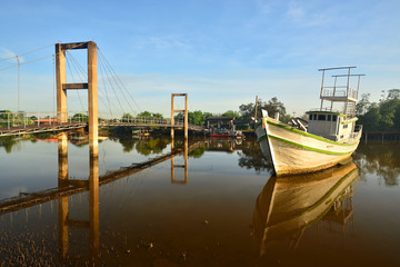 Fototapeta premium Ruksamae bridge across the canal to see the mangrove forest
