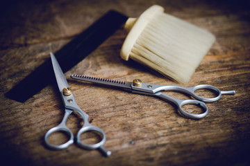 hairdresser tools on wooden table