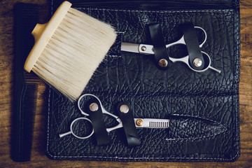 hairdresser tools on wooden table
