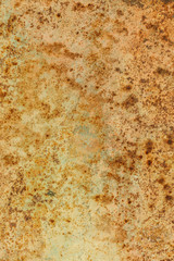 Rusted painted metal wall. Rusty metal background with streaks of rust. The metal surface rusted spots