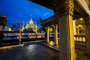 Fototapeta na wymiar Loha Prasat light up at night, Famous Wat Ratchanatda in Bangkok, Thailand