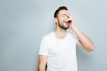 Fototapeta premium Delighted guy feeling happiness at the moment